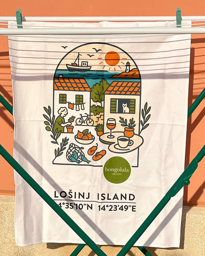 Cotton tea towel with an illustration of island life with Lošinj Island coordinates and Bongolala logo hanging on a clothes line.