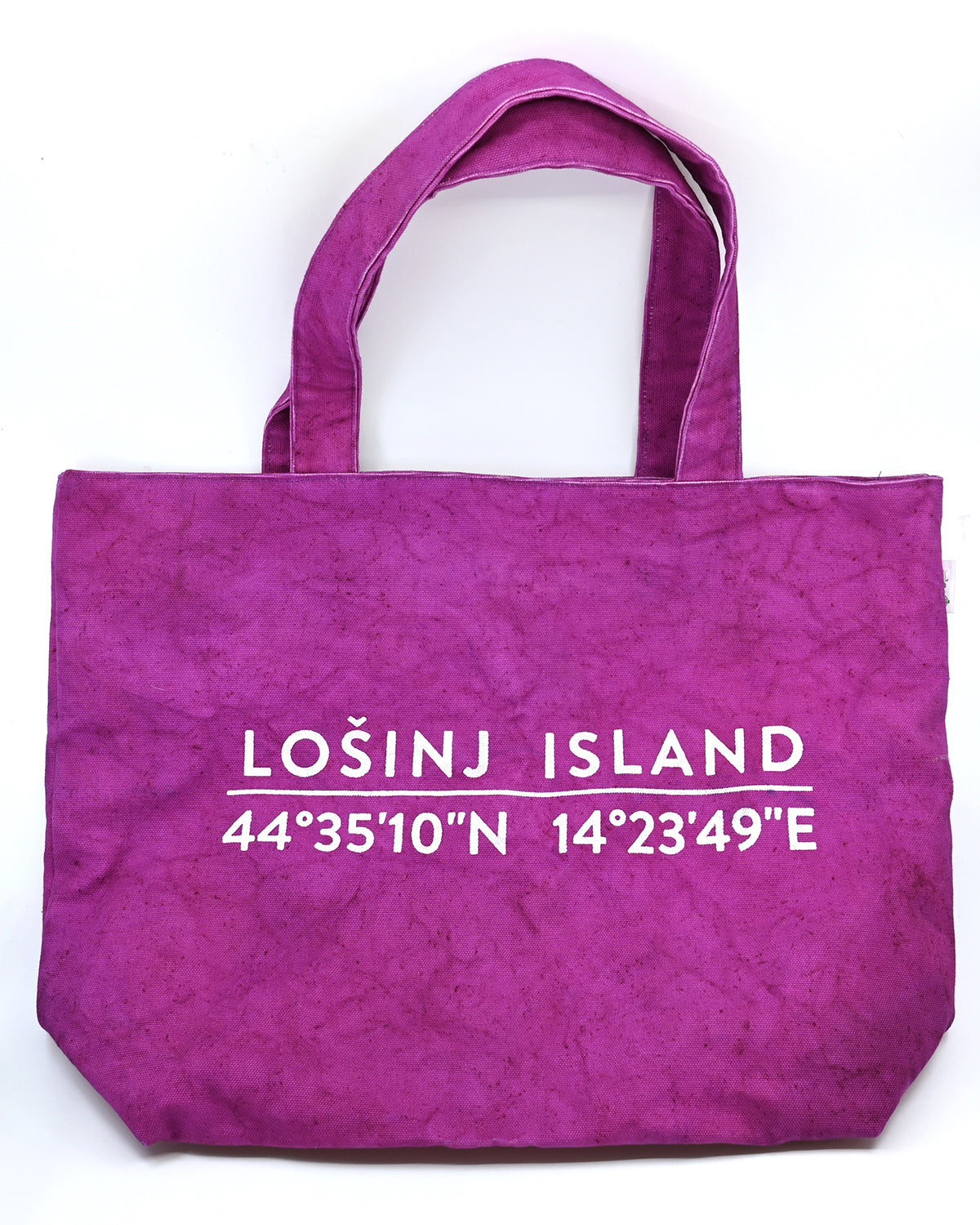 Oversized cotton canvas shopper bag in pink with white screen printed Lošinj Island coordinates design on one side.