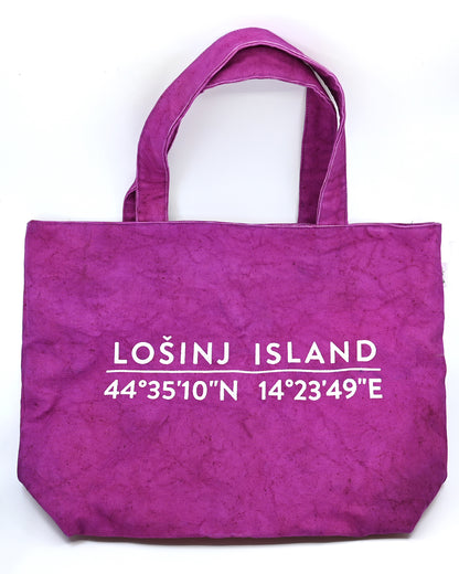 Oversized cotton canvas shopper bag in pink with white screen printed Lošinj Island coordinates design on one side.