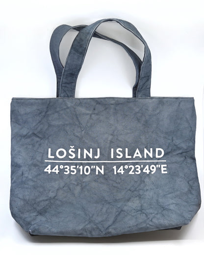 Oversized cotton canvas shopper bag in grey with white screen printed Lošinj Island coordinates design on one side.