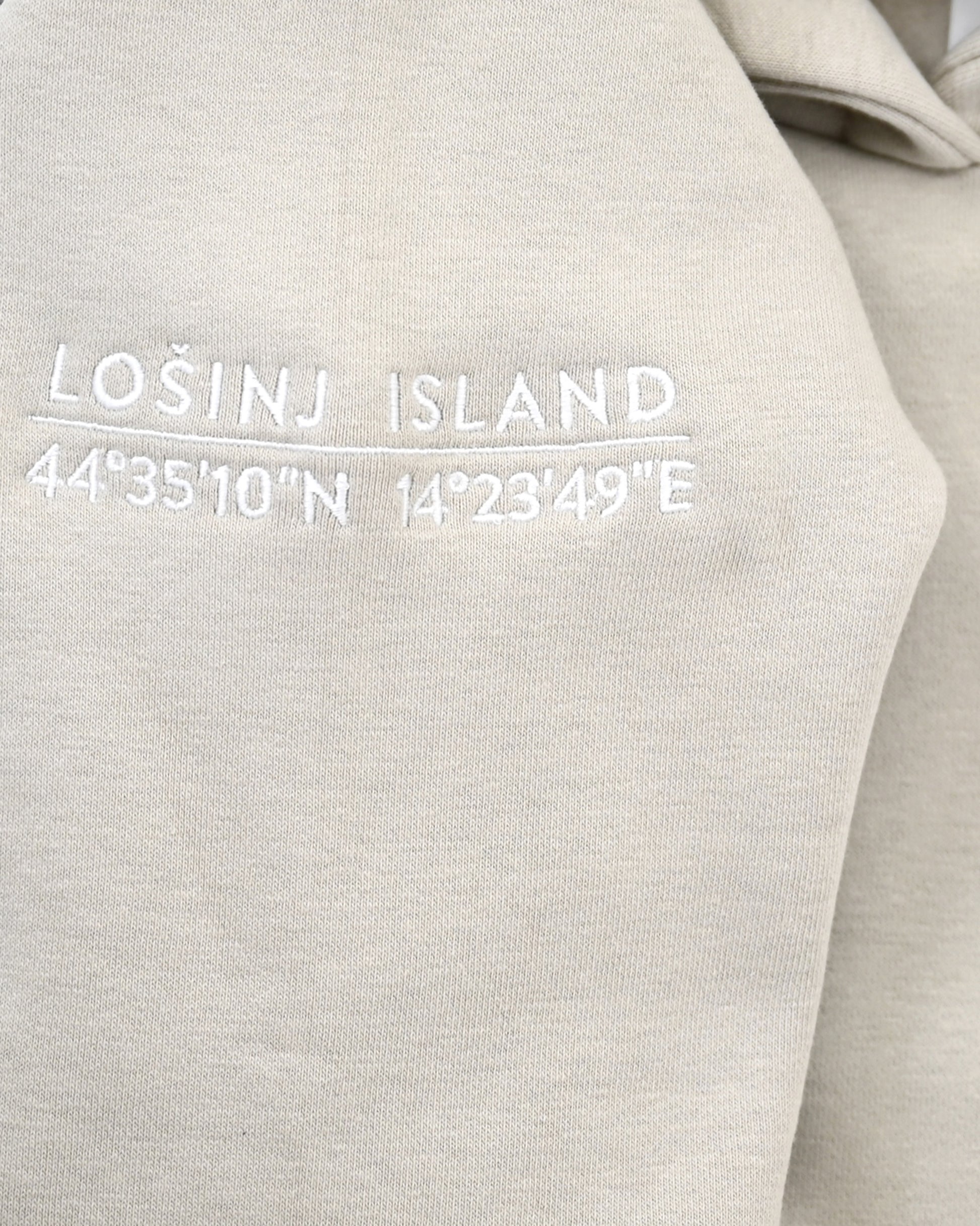 Premium, heavy hoodie  with Lošinj island coordinates stitched on the sleeve.