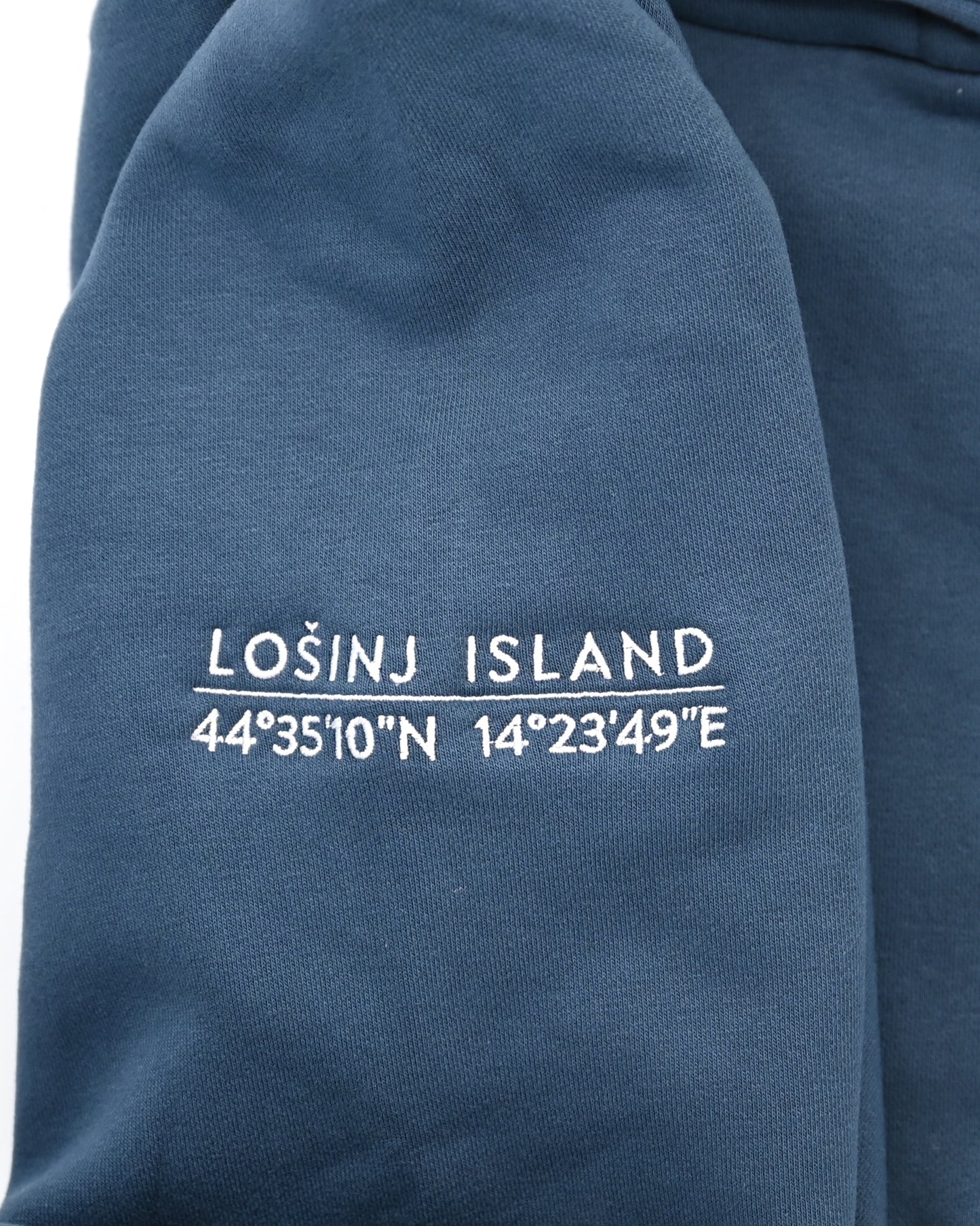 Premium, heavy hoodie  with Lošinj island coordinates stitched on the sleeve.