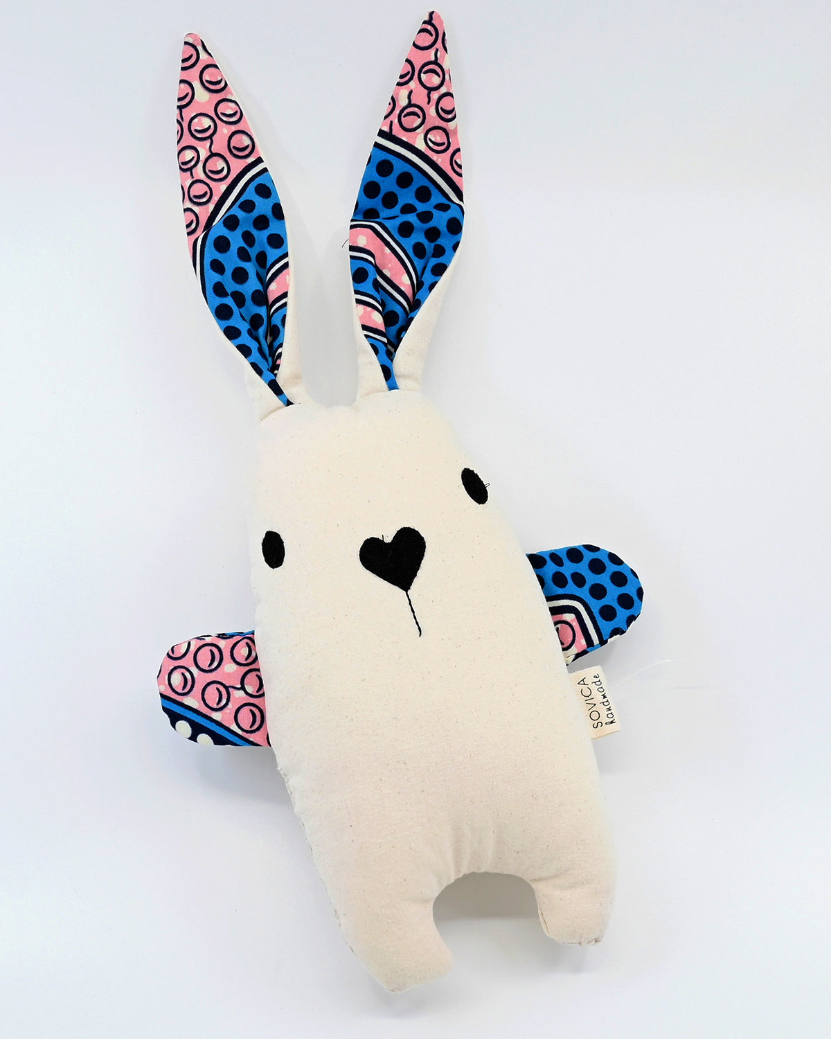 Soft rabbit toy by Croatian designer Sovica, made from cotton nautical stripes or African wax fabric and suitable for babies and children.